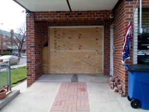 An accident in April left Middle Village resident Theresa Doria's garage damaged.   Photo By  Alan Krawitz