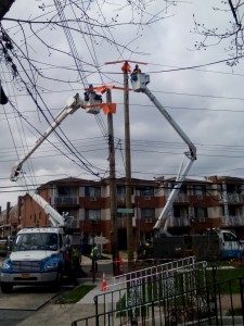  A Con Ed repair crew works on the pole damaged in the accident. Photo by Alan Krawitz