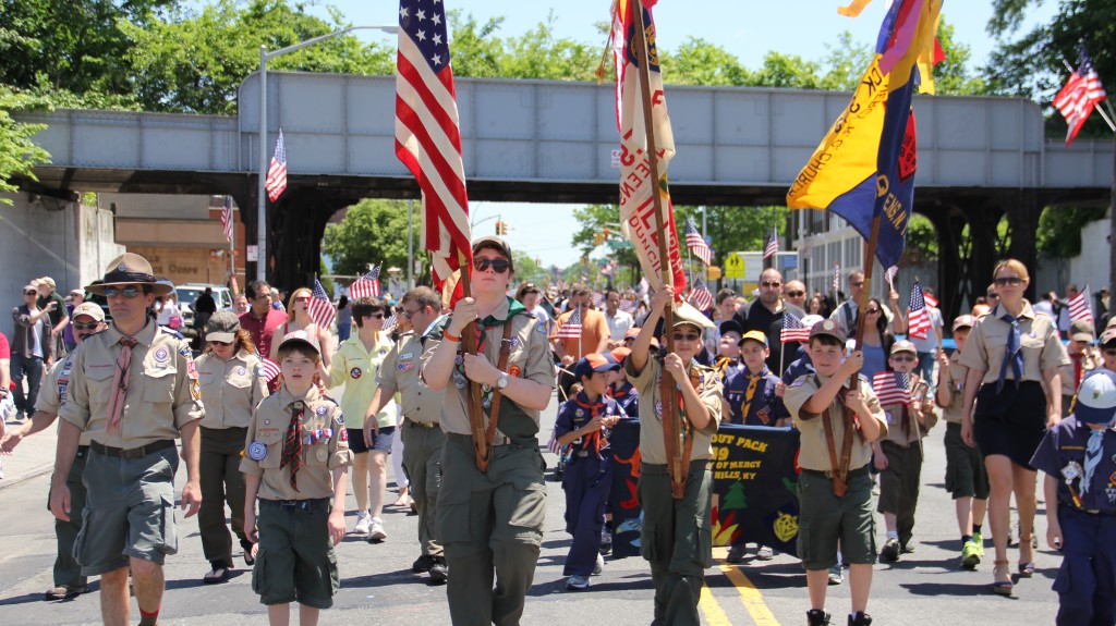 Boy Scouts and Cub Scouts proudly march down Metropolitan Avenue. Photos by Cesar R. Bustamante, Jr.