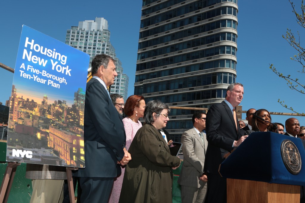 Mayor Bill de Blasio, at podium, recently announced a plan to create more affordable housing throughout the city. Photo courtesy NYC Mayor's Office