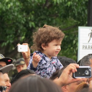  Atop shoulders, Soline Polanco, 2, had one of the best views of the musical acts in the crowd.  Photo by Anna Gustafson