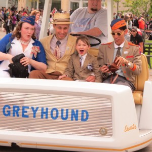 Stephanie, left to right, Kyle, and Eric, 6, Janssens and Voon Chew, all of whom are collectors of World's Fair memorabilia, spend time on a "Greyhound escorted" that had been at the 1964 World's Fair.   Photo by Anna Gustafson