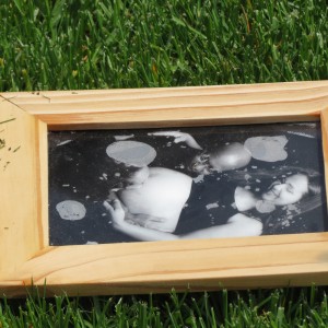 A water-damaged photo dries on a Lindenwood yard.    Photo by Anna Gustafson
