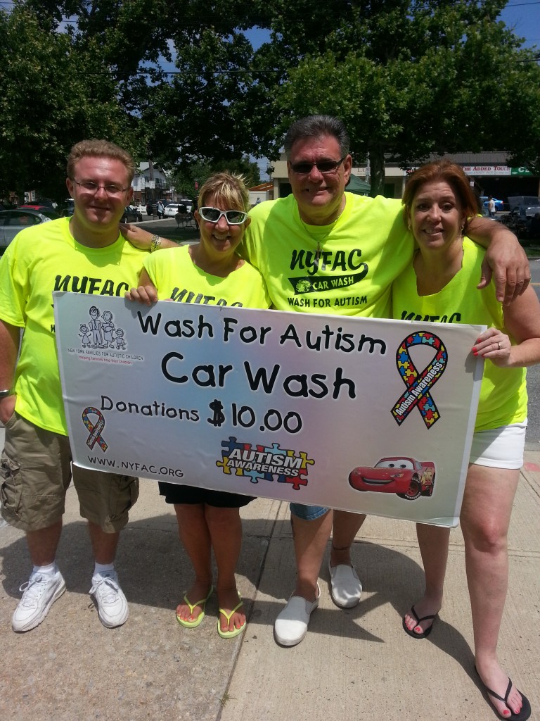 Volunteers Rob Long, Karen Long, Andrew Baumann, president/CEO-NYFAC and Cathy Placco, Queens County Savings Bank Manager are all smiles at the 8th Annual Charity Car Wash and Car Show -Wash fr Autism.  Photo by Debbie Cohen
