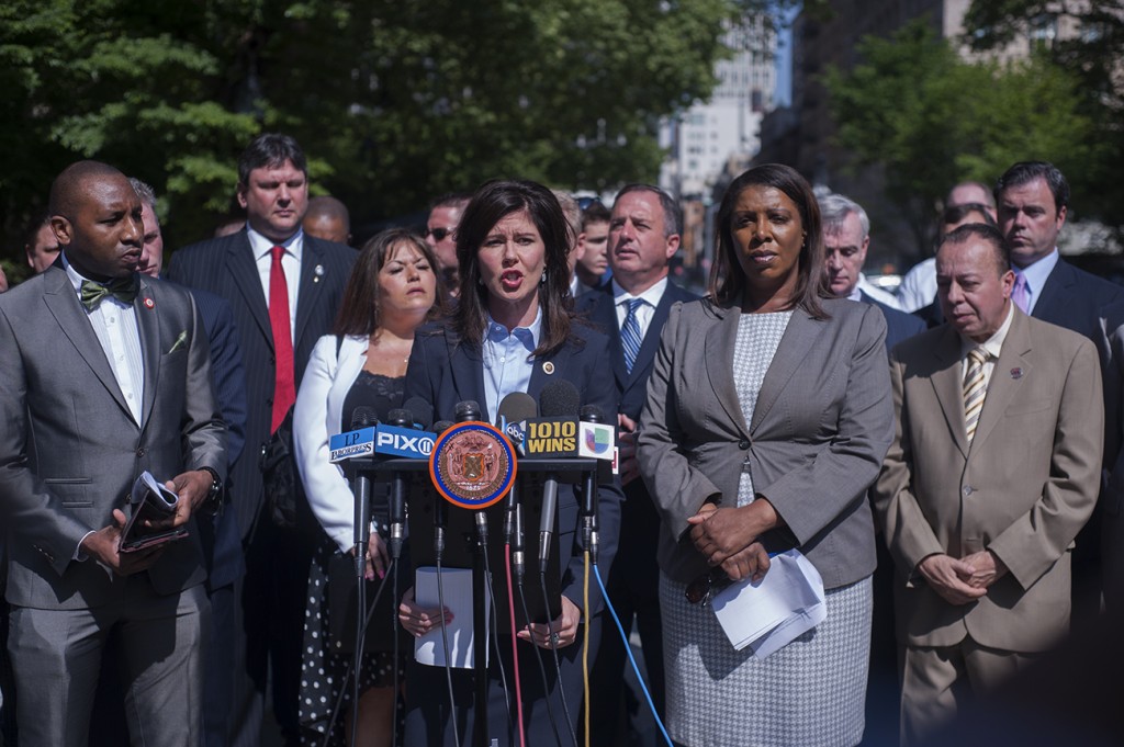 Councilwoman Elizabeth Crowley, center, was joined by other elected officials, including Public Advocate Letitia James, right of Crowley, outside City Hall last week to call on the mayor to overhaul the city's emergency response system.  Photo courtesy William Alatriste/NYC Council
