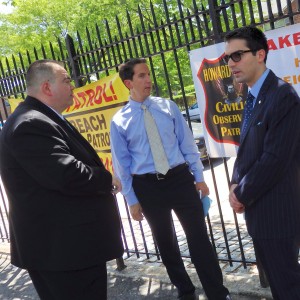 City Councilman Eric Ulrich (r.) and state Assemblyman Phil Goldfeder (c.) hear Joseph Thompson's goals in starting the new Howard Beach Civilian Observation Patrol.  Photo by Phil Corso