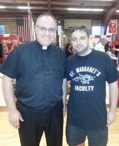 Monsignor Steven Aguggia, pastor of St. Margaret Parish and Dr. Phillip Fraco, principal of St. Margaret School are all smiles at the bazaar. Photo by Debbie Cohen