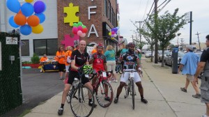 The first three cyclists back from the 20-mile loop struck a pose before going back to the registration zone for a barbecue.  Photo by Patricia Adams