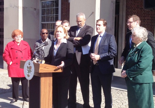 Lawmakers join Borough President Melinda Katz (c.) pitch sweeping reforms to the Queens Library system outside borough hall in April.  File Photo