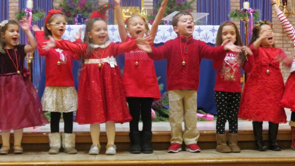 All this pre-k class wants for Christmas is their two front teeth as they belt out the holiday classic Friday evening at St. Helen Catholic Academy's Christmas Pageant. Forum Photo by Michael V. Cusenza