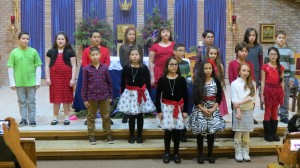 The standing-room only crowd inside the church was clearly moved by these 5th-graders' recital of the solemn "O Holy Night." Forum Photo by Michael V. Cusenza