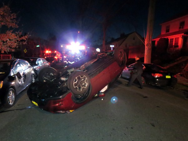The car landed upside down, damaging other vehicles in the process. Forum Photos by Robert Stridiron