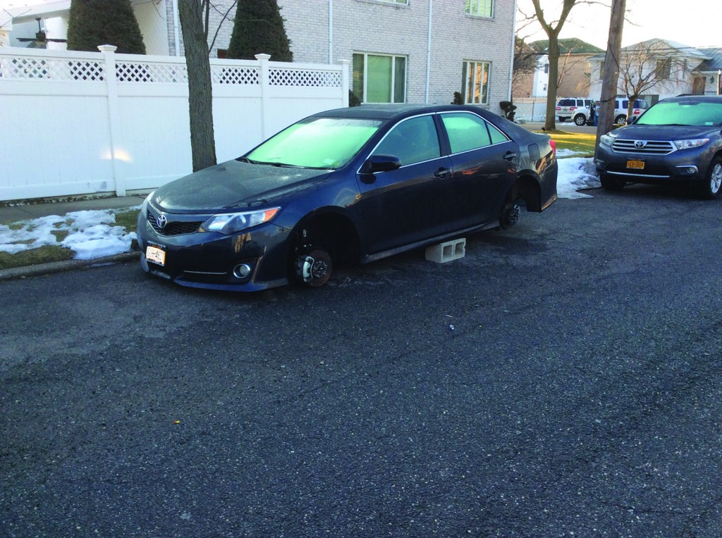 106th precinct cops nabbed a trio of thieves after they removed the tires and rims from this late model Toyota on 88th street in Howard Beach at about 3:30 on Tuesday morning.