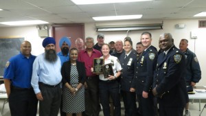  Lt. Courtney Nilan, Special Operations coordinator, accepted awards from 102nd Precinct brass and its Community Council. Nilan recently was promoted to captain.  Forum Photos by Greg Zwiers.