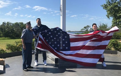 Two Howard Beach Cousins Replace old Charles Park Flag with Brand-New, Bigger Version