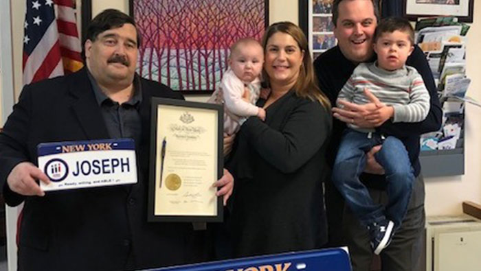 Miller Presents Constituent with Personalized Down Syndrome License Plate
