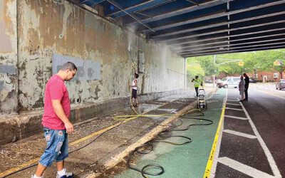 Volunteers Prep Site for Sept. 11 Mural