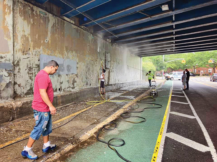 Volunteers Prep Site for Sept. 11 Mural