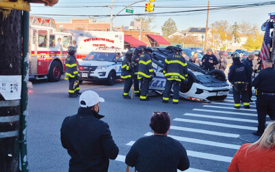 Four Cops Injured after Car Flips on Cross Bay Blvd.