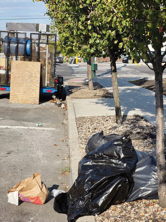 Forum Photo by Patricia Adams Garbage, courtesy of the vendor and some of its patrons, piled up daily on the corner.