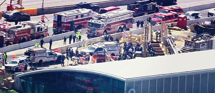 Photo Courtesy of WABC-TV Crews work to free the two workers from the rubble on Monday at JFK Airport.