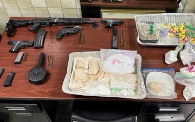 Search Warrant Nets Cache of Drugs and Guns