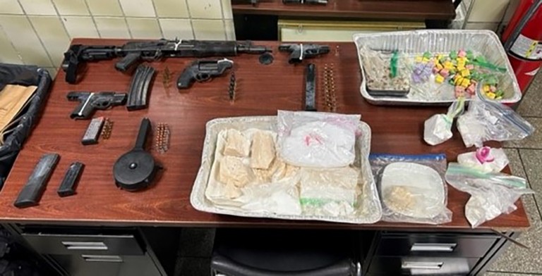 Search Warrant Nets Cache of Drugs and Guns