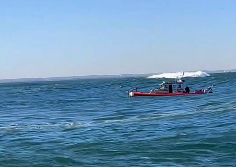 Firefighters Save Two People Tossed in Water after Boat Capsizes