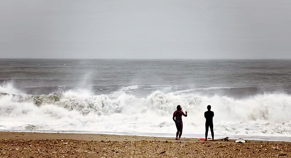 Photo Courtesy of Facebook/Krzysztof Koscikiewicz A small group of surfers on Monday actually sought out towering swells in Rockaway Beach.